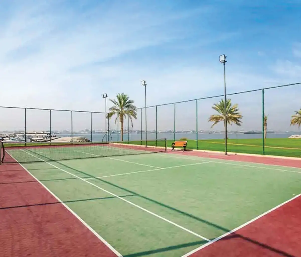 Beachfront villas surrounded by lush greenery at Mangrove Village