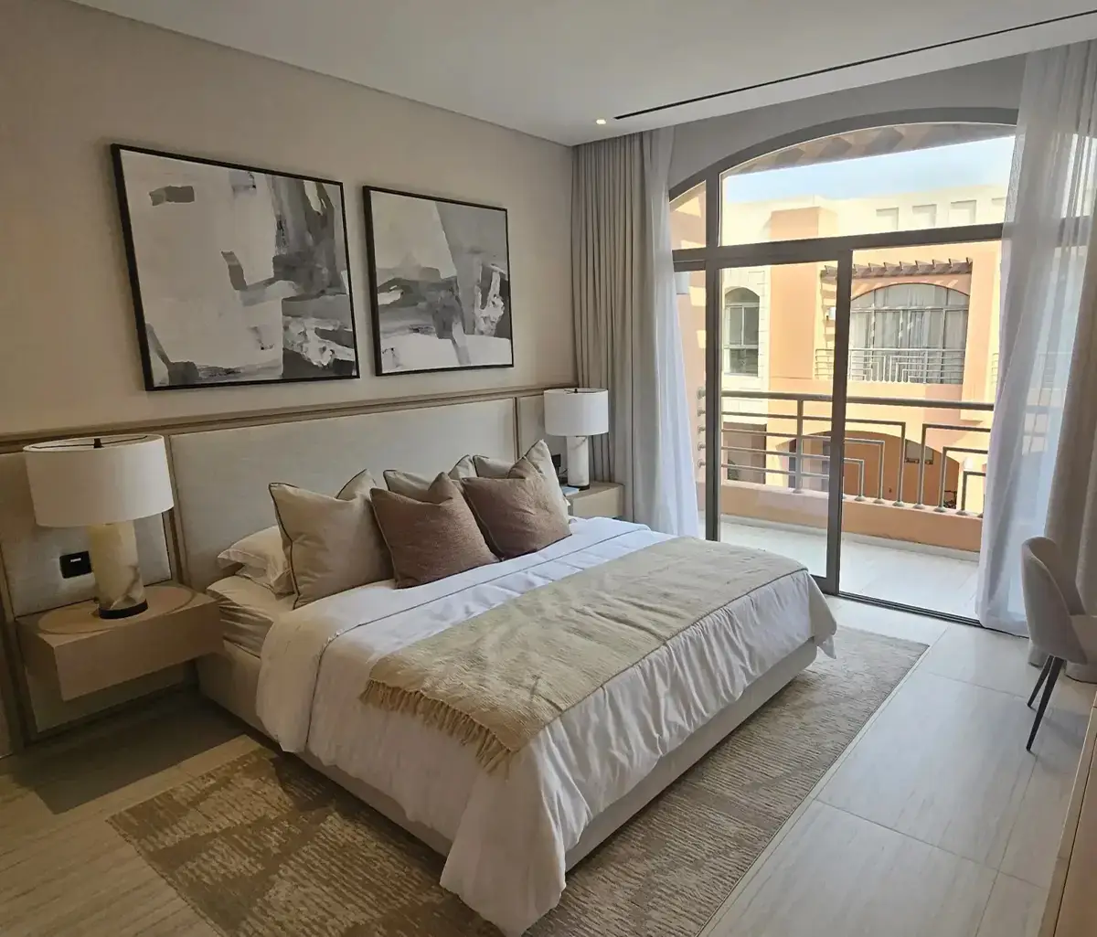 Master bedroom with private balcony and garden-facing views